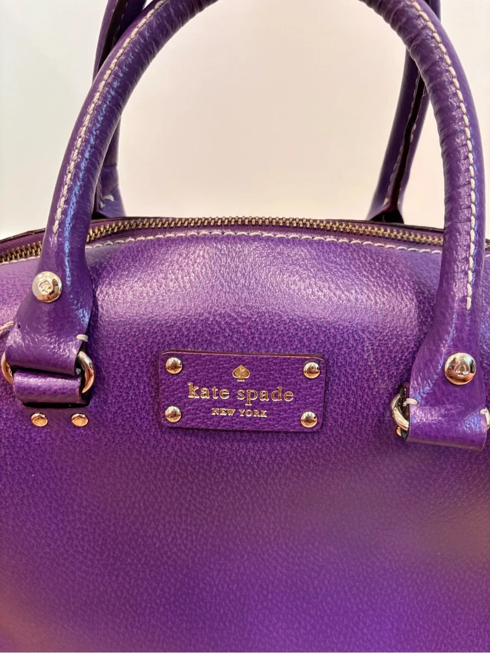Kate Spade Alessa Wellesley handbag in a vibrant plumberry purple leather